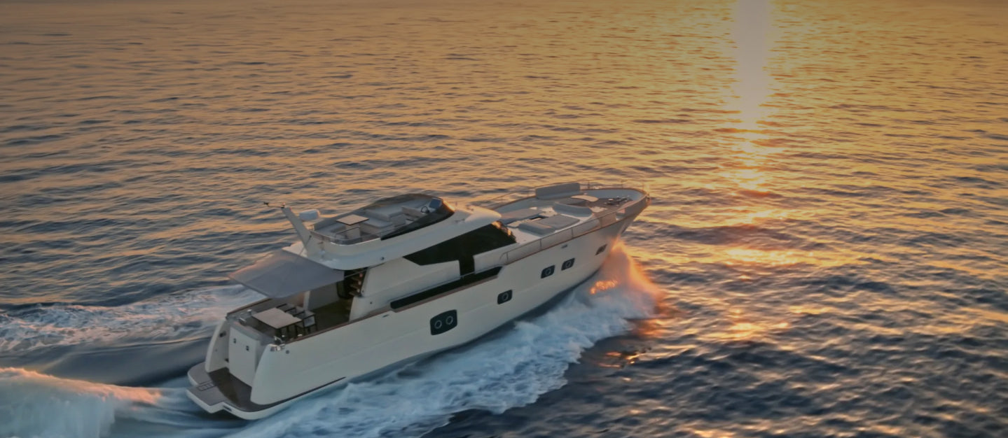 Motor yacht underway at sunset
